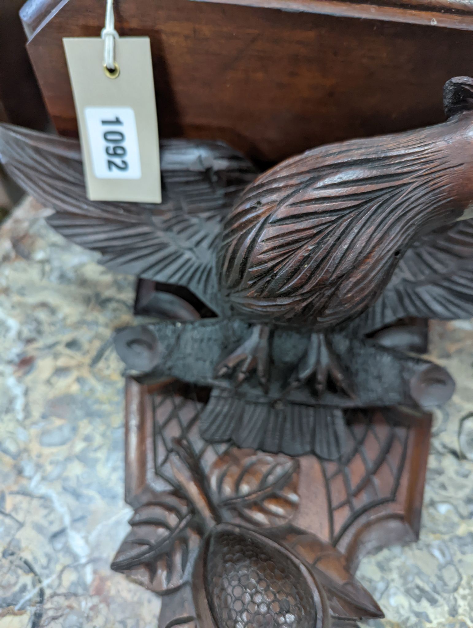 A Black Forest carved eagle wall bracket, width 34cm, height 30cm